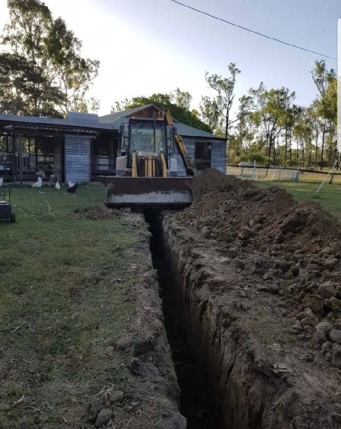 Backhoe Digging a Trench — MCA Plumbing & Drainage in Jensen, QLD