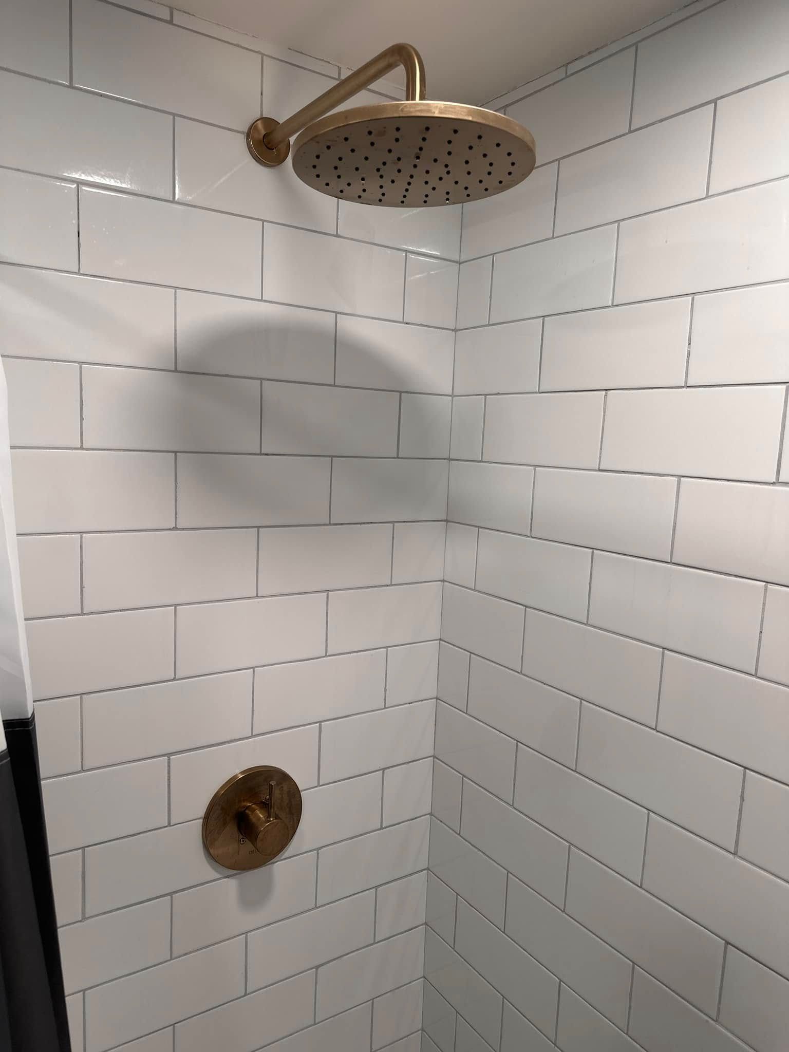 a new shower with a waterfall showerhead