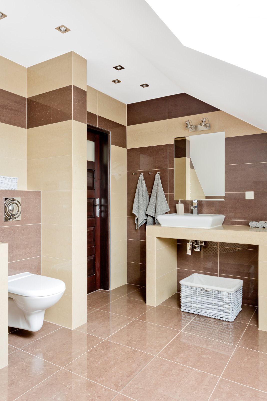 A bathroom with a toilet , sink and mirror