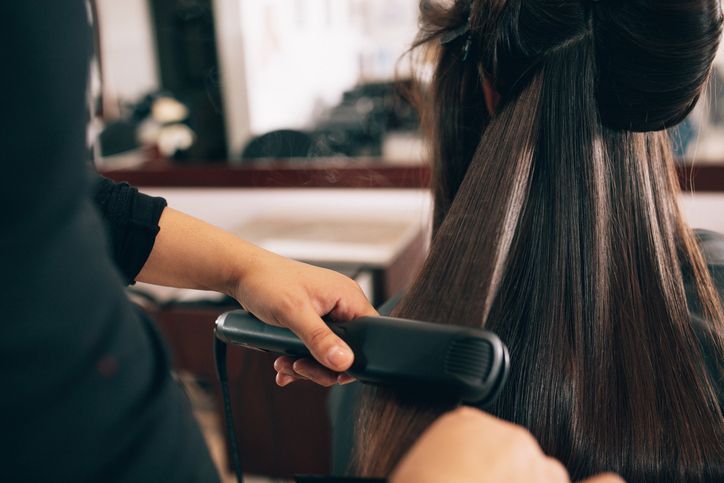 Woman at the hair salon getting her hair styled