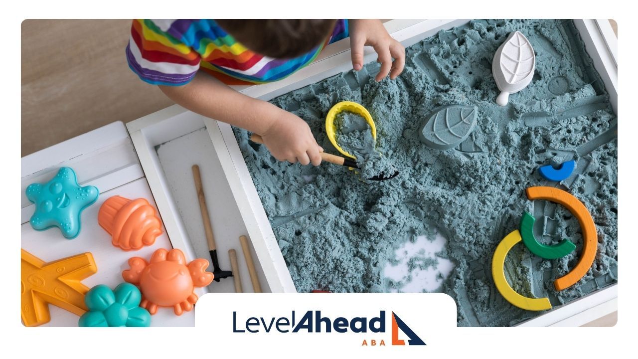 Child with autism engaging with colorful sensory toys and learning materials