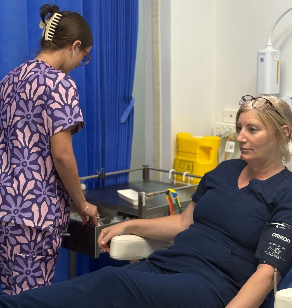 Woman Sitting On A Chair Inside A Medical Centre In Mackay