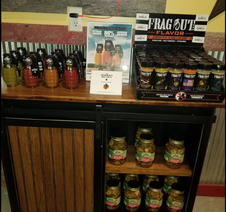 A shelf full of jars and bottles of fragrant flavor