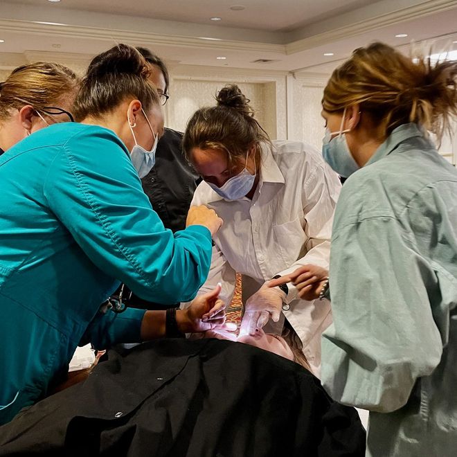 FunctionFocus' Make The Connection course students practicing on patient during a class