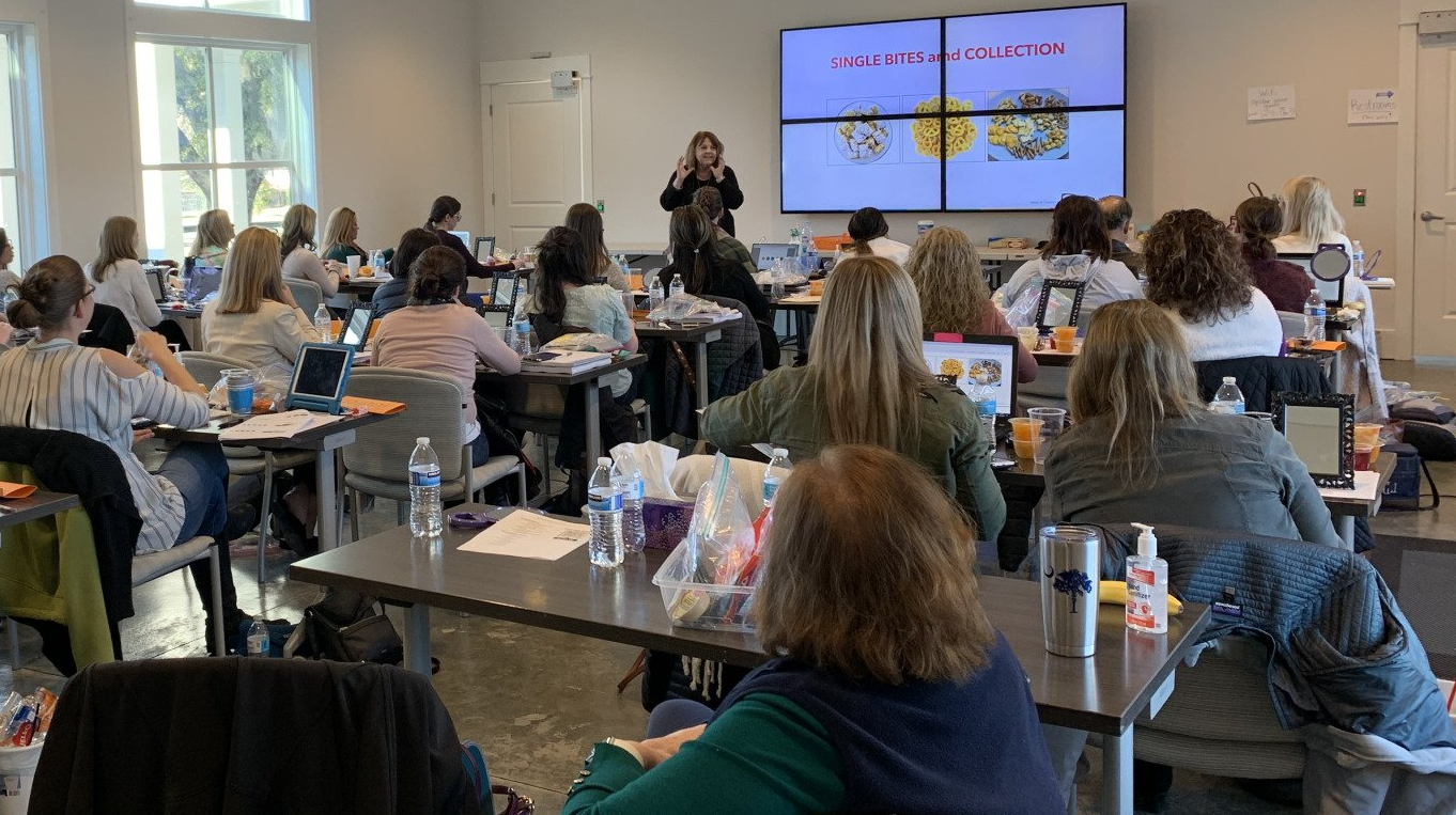Mary Billings teaching a course in front of class in Charleston, SC