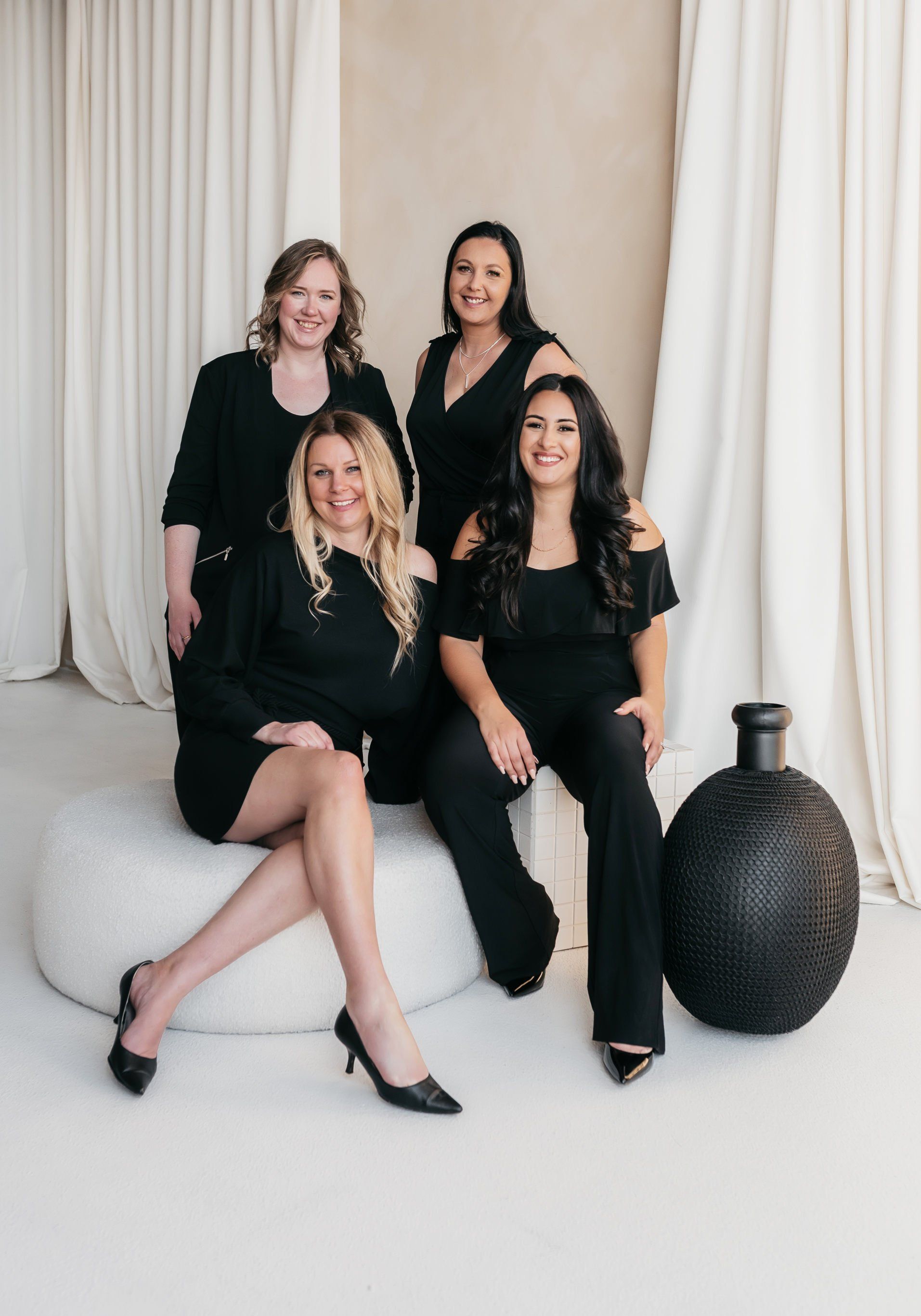 A group of entrepreneurs wearing all black stylish outfits