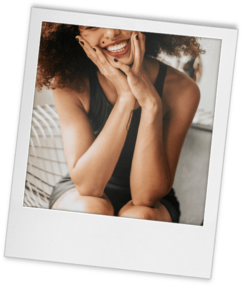 Headshot tip 10 polaroid of a woman sitting while laughing