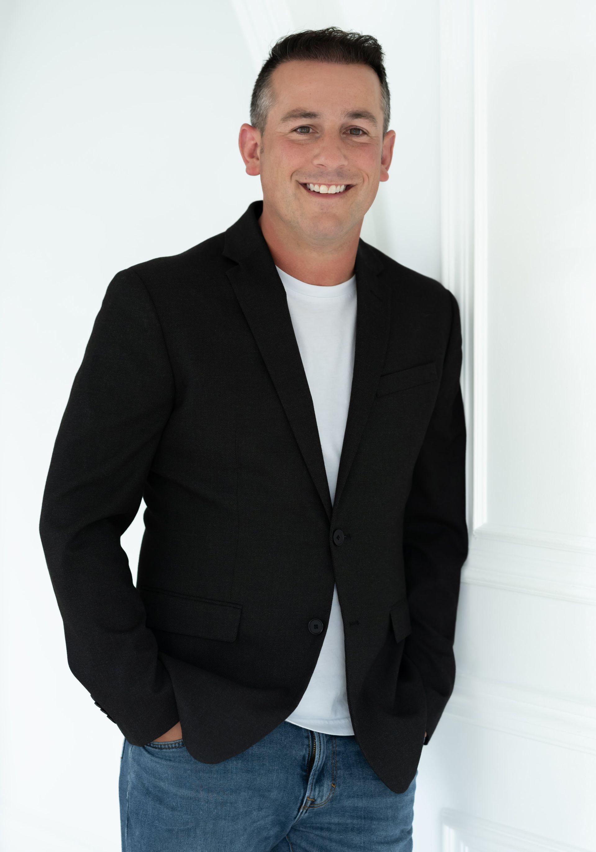 A close-up of a man in a smart casual outfit, with a friendly and professional demeanor, ideal for a personal branding image.