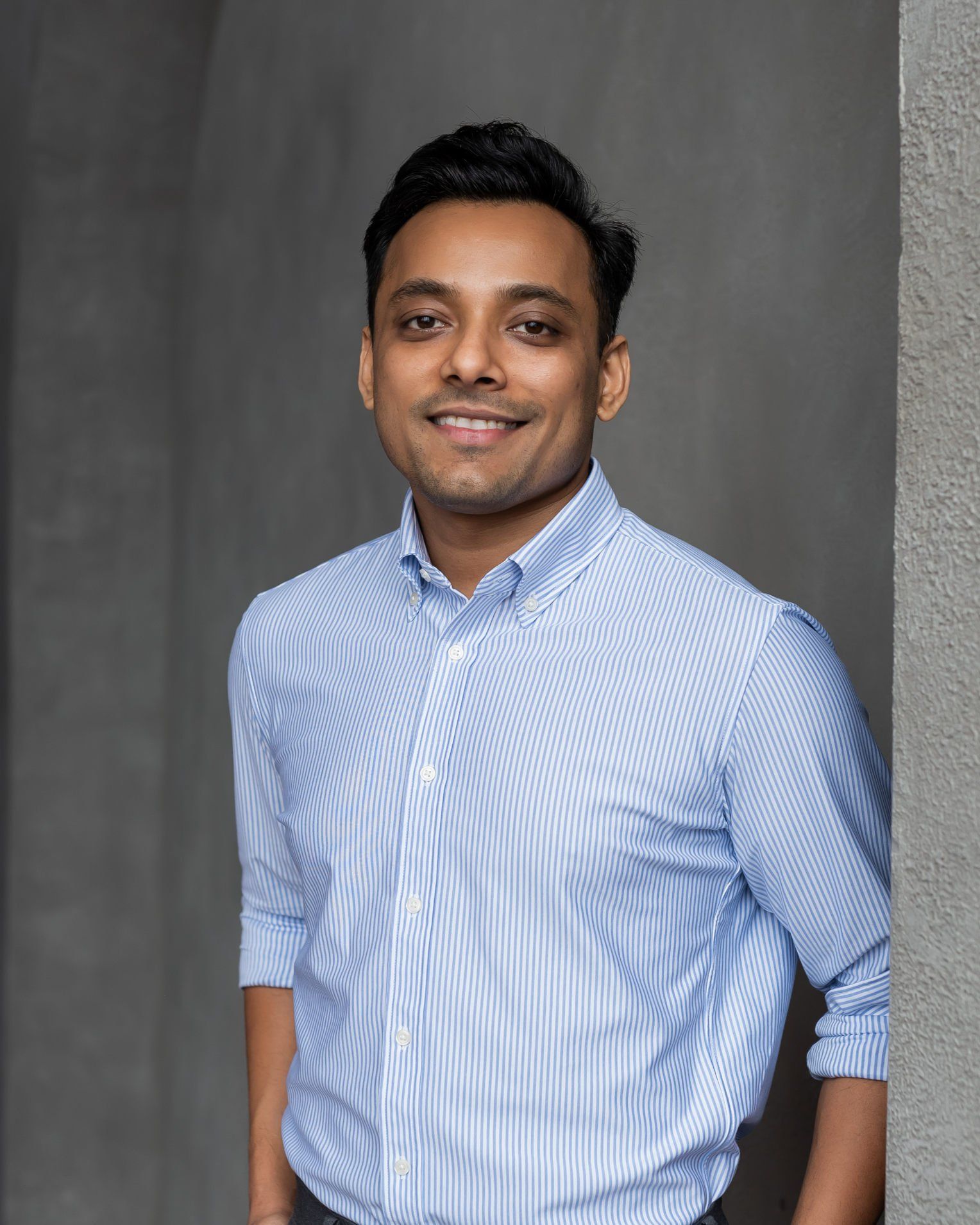 A professional wearing a light blue button down