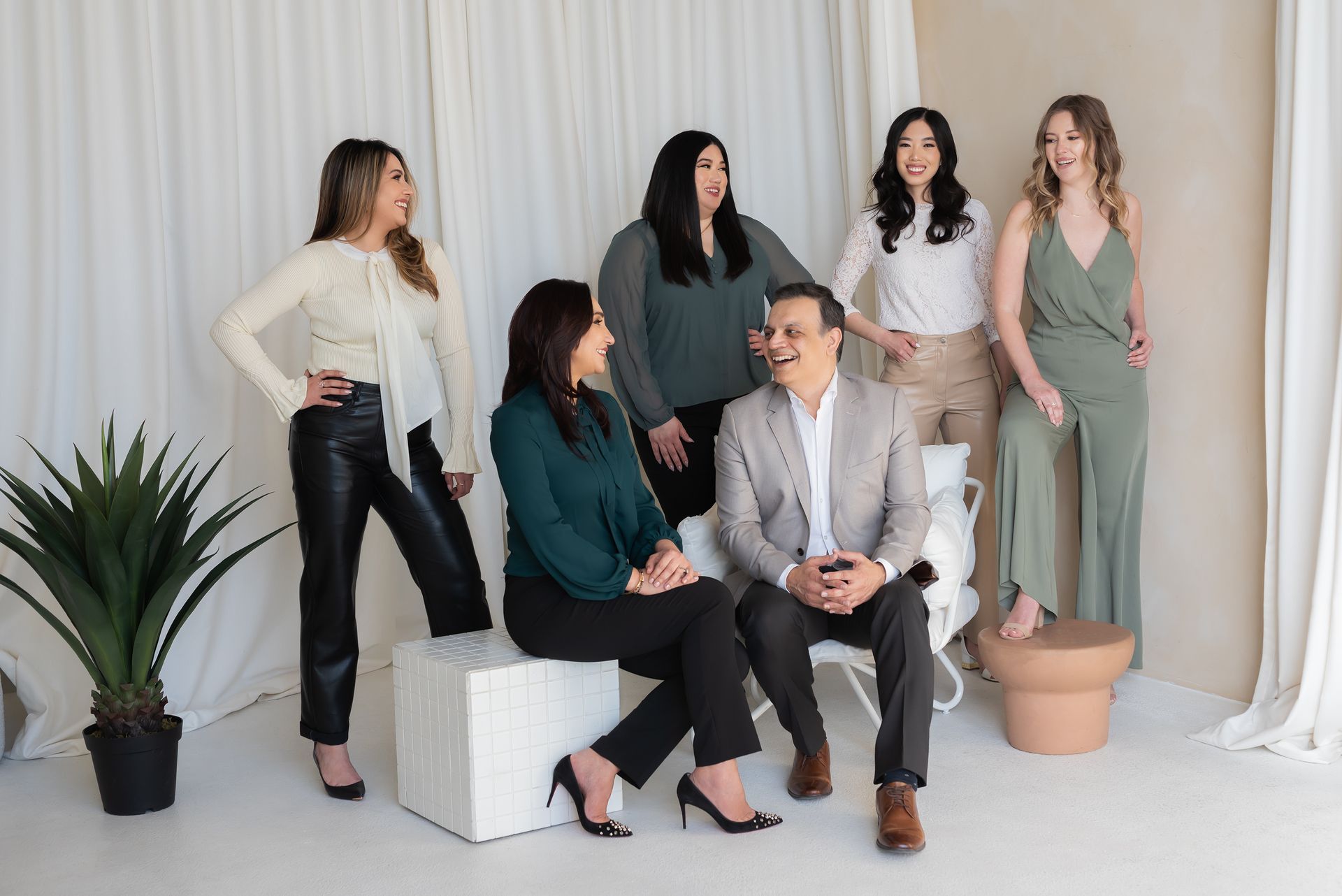 team of realtors talking and smiling to each other