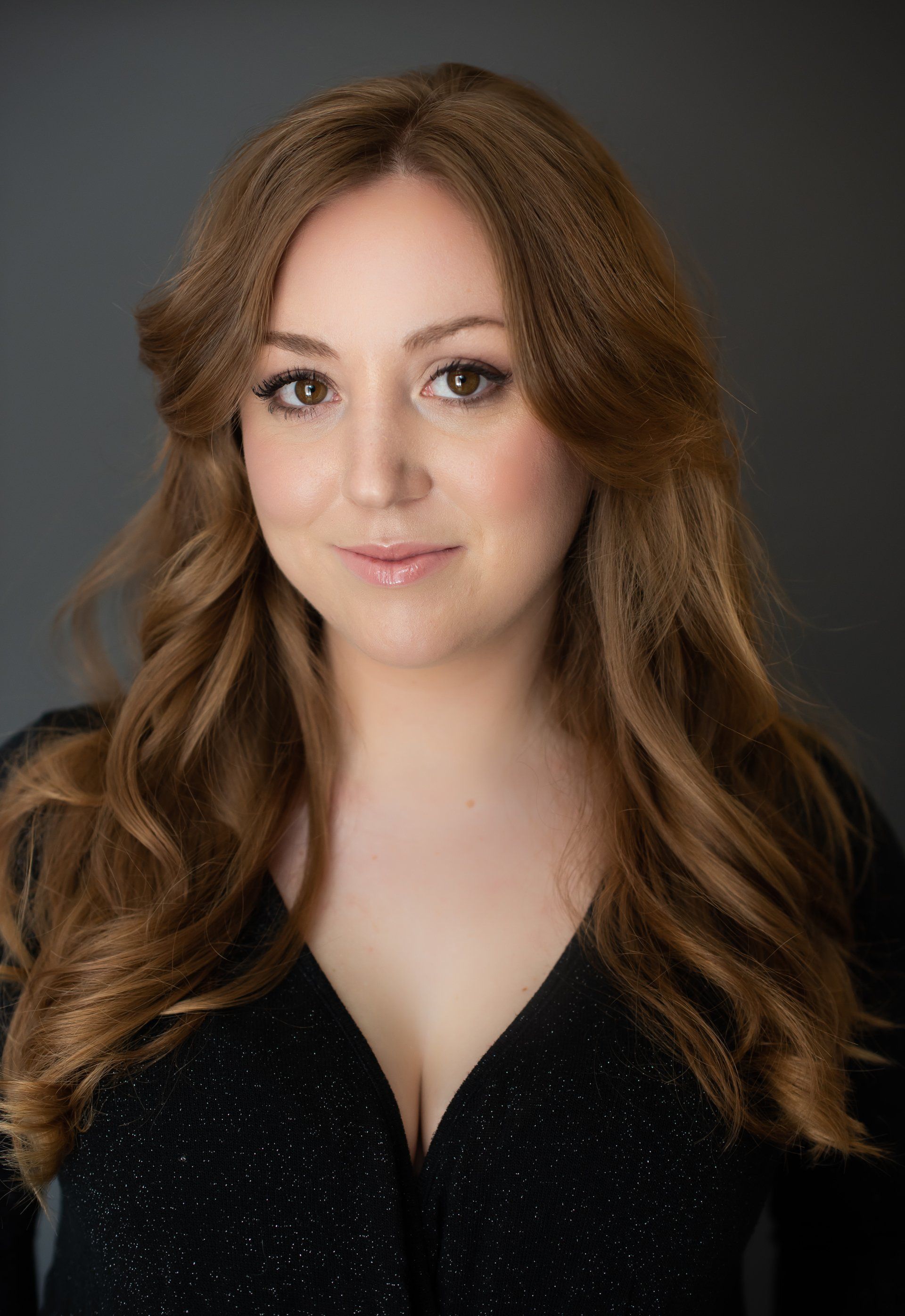 A young professional wearing a black blouse