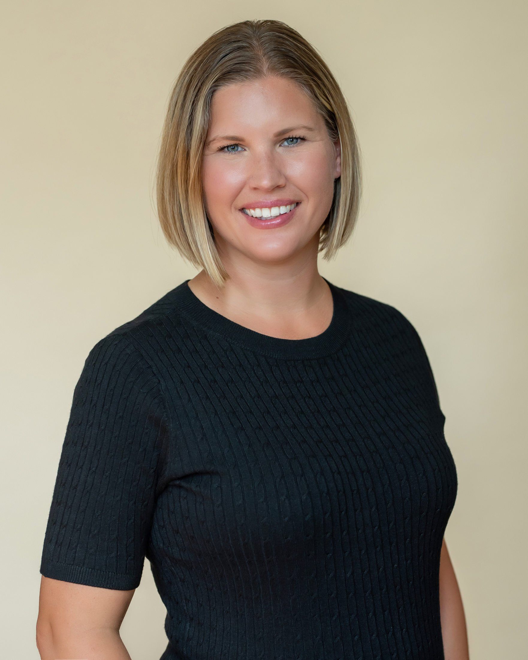 Professional headshot of a dental hygienist