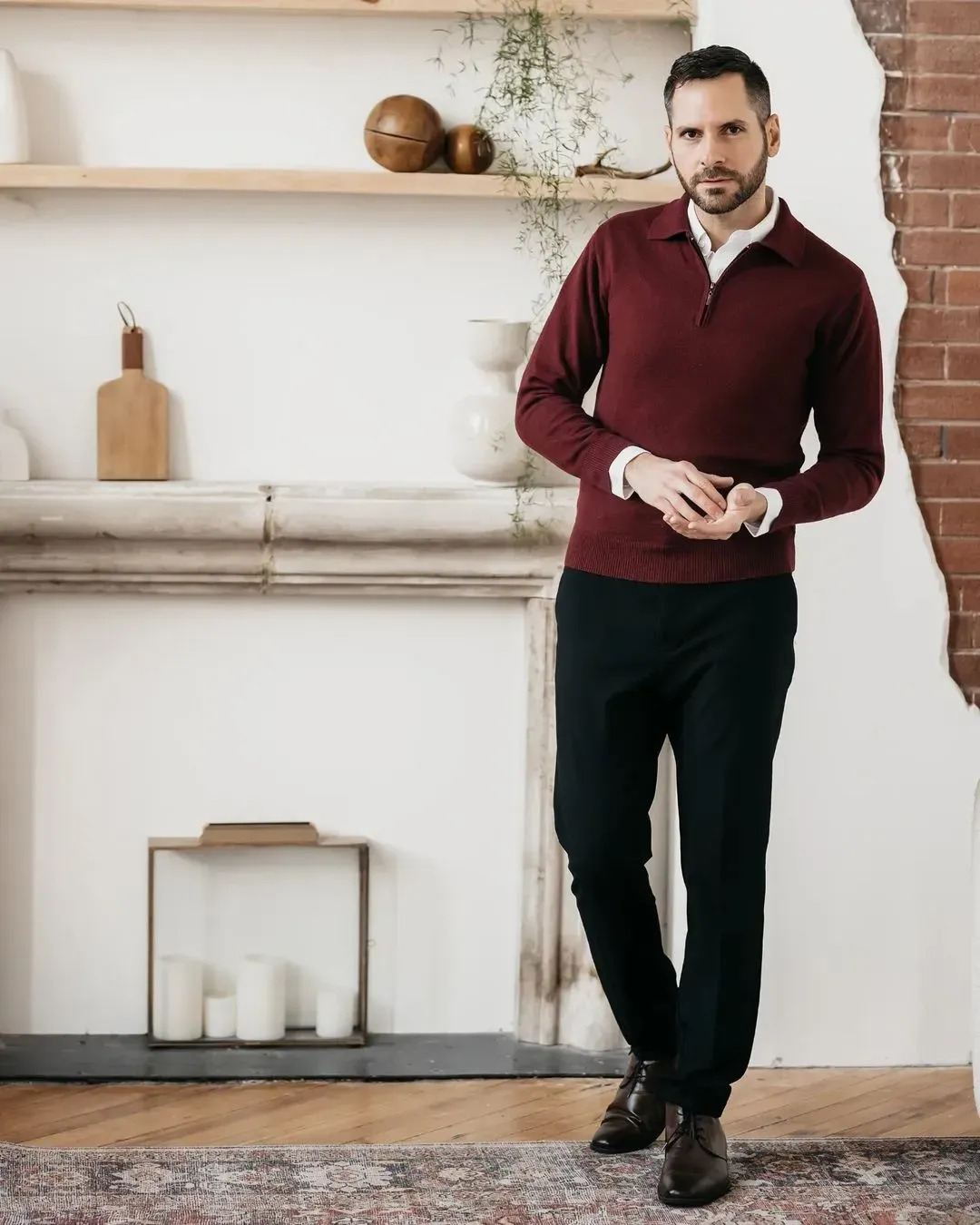 man in a red long sleeves top looking at the camera
