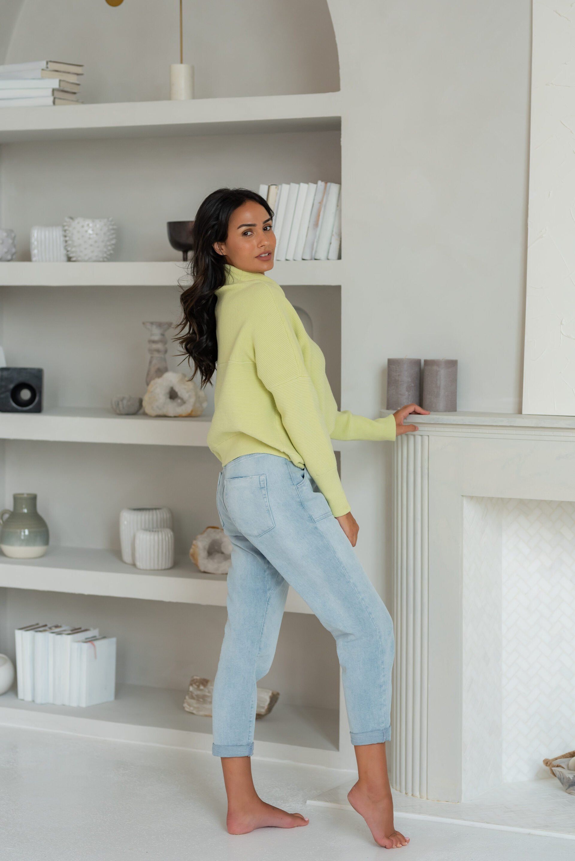 Social influencer Chantel in a casual lime green sweater and jeans