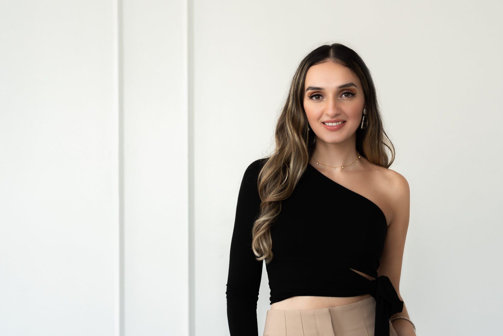 A Toronto project manager smiles and faces the camera in a headshot photo.