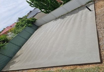 A light brown colour decent sized concrete shed slab freshly poured for a Wanneroo WA homeowner.
