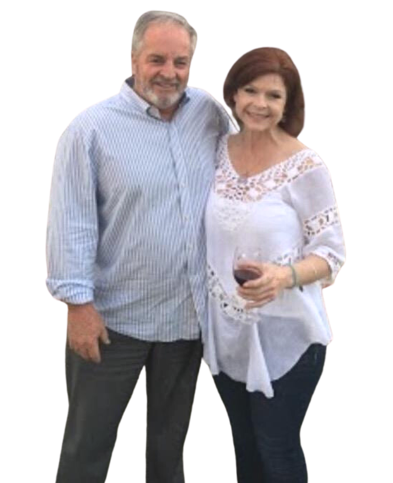 A man and a woman are posing for a picture and the woman is holding a glass of wine.
