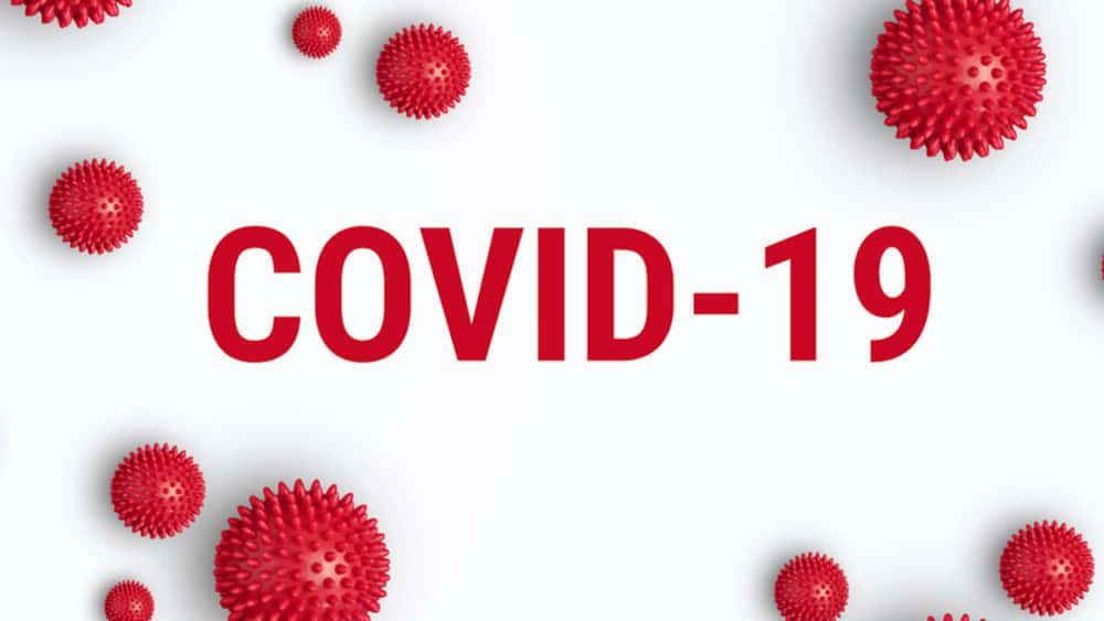 COVID-19 text in red, with red spiky ball illustrations against a white background.