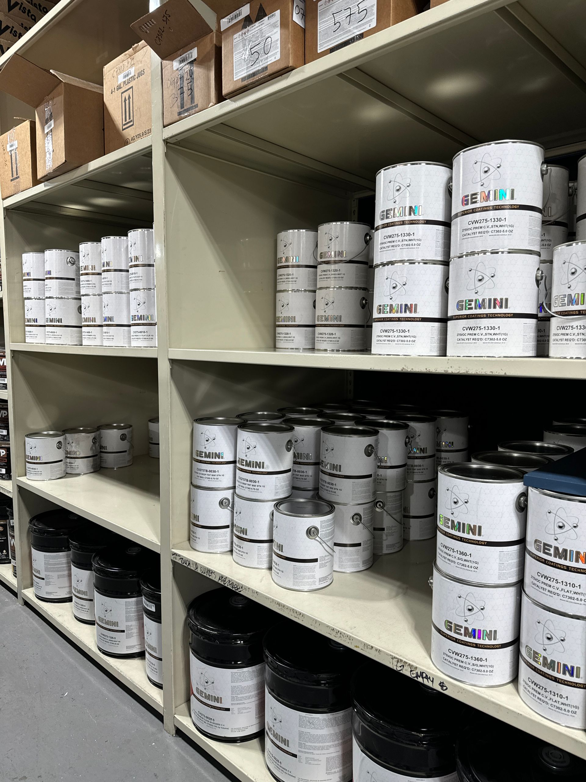 A warehouse filled with lots of cans of paint