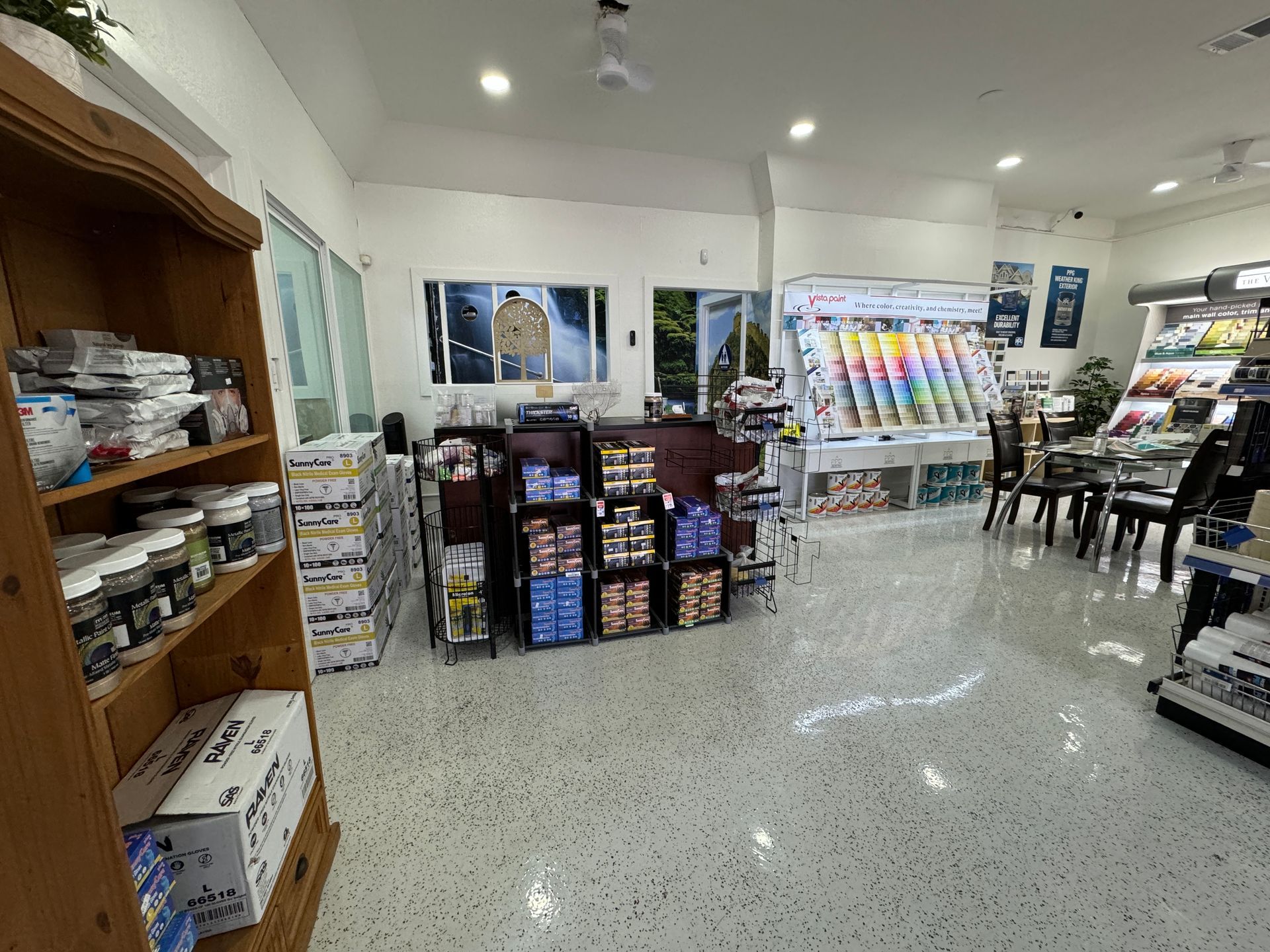A store filled with lots of shelves and boxes of paint.