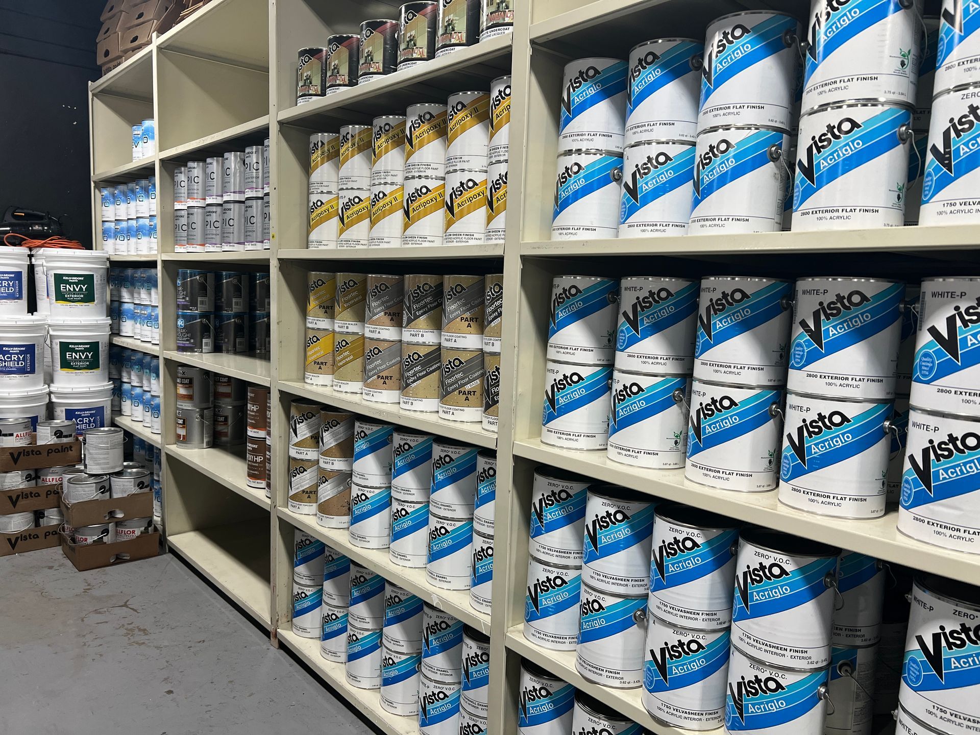 A warehouse filled with lots of cans of paint.