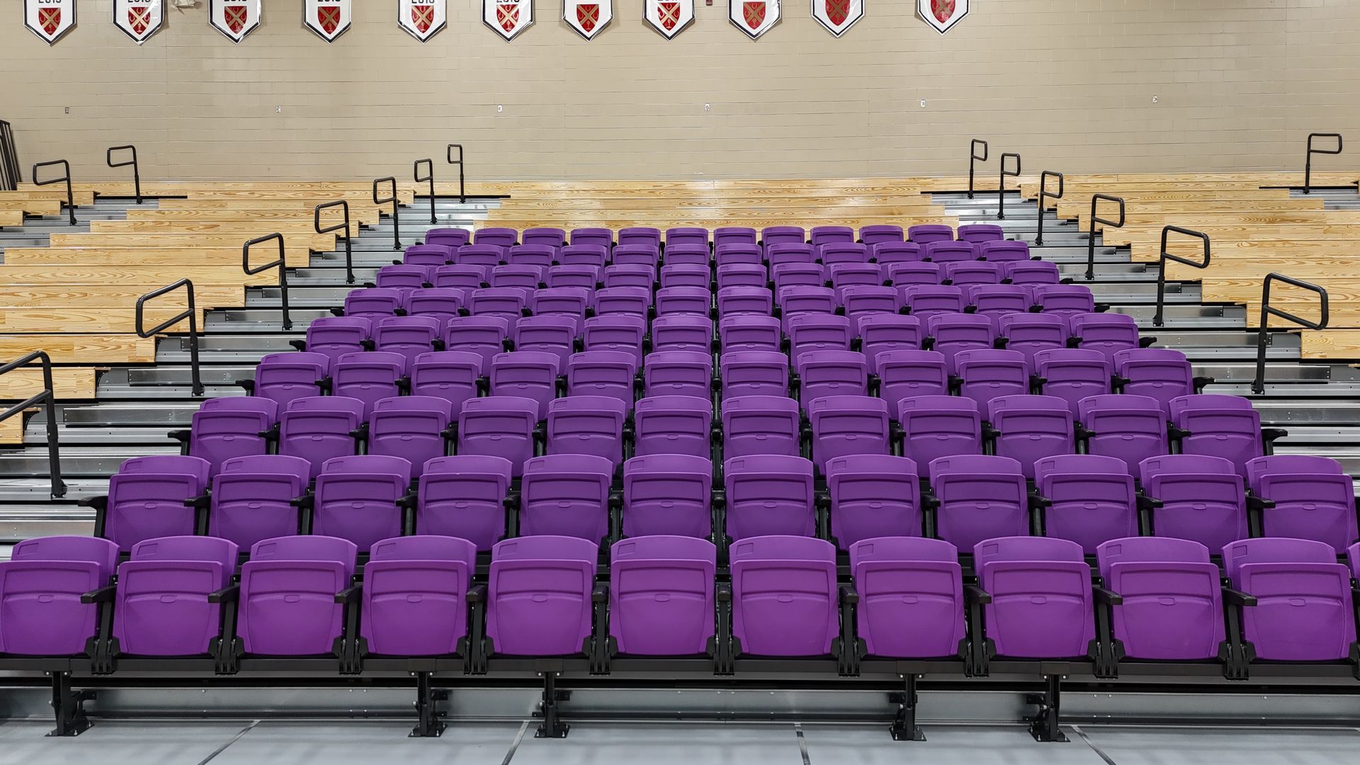 The telescopic bleacher system at Father Ryan High School in Tennessee, featuring a VIP section of VISION Platform chairs.