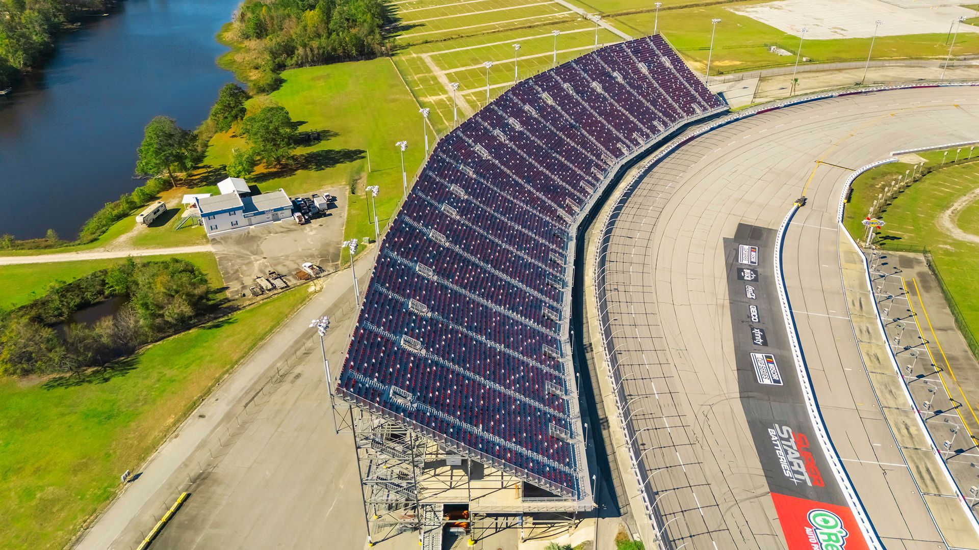 Darlington Raceway photos, featuring VISION Fixed Outdoor Chairs with armrests and cupholders.