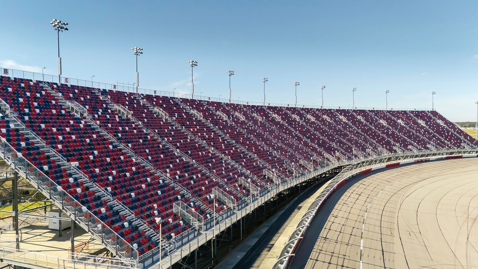 Darlington Raceway photos, featuring VISION Fixed Outdoor Chairs with armrests and cupholders.