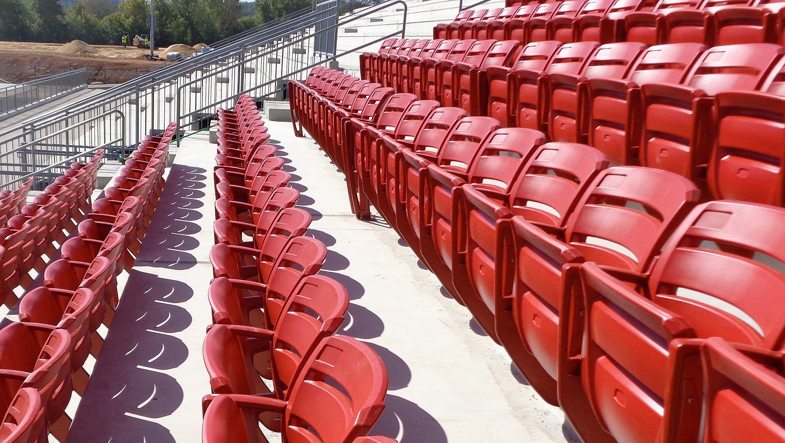 Red Interkal AURA Slat Stadium Chairs adorn the alumni section of the Hewitt-Trussville High School football stadium.