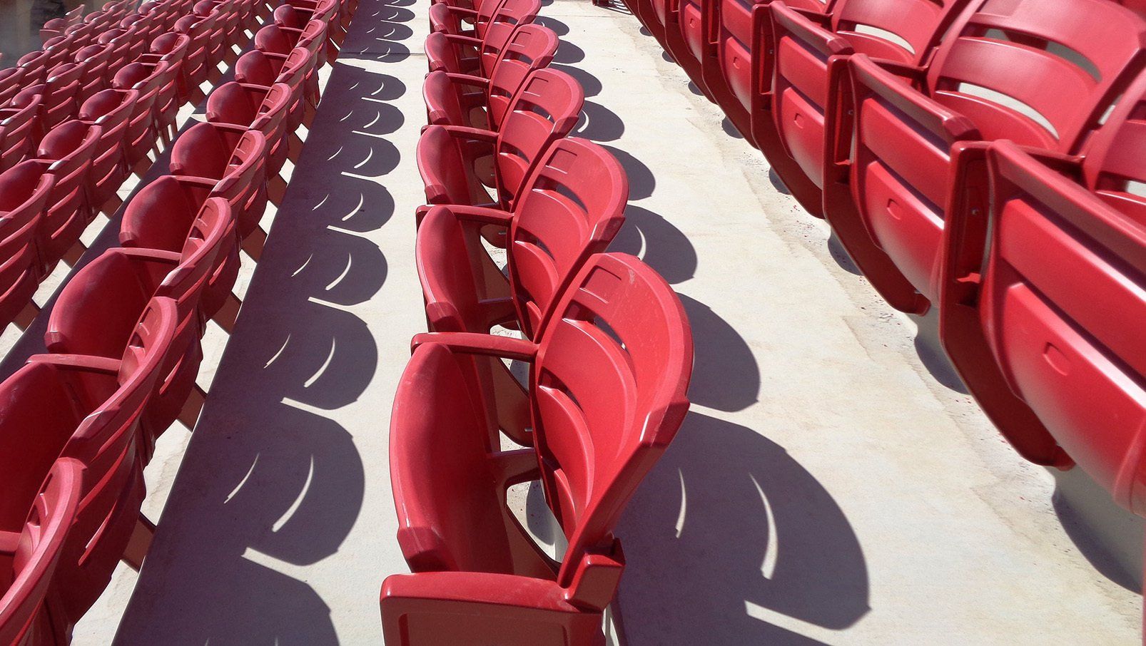 Red Interkal AURA Slat Stadium Chairs adorn the alumni section of the Hewitt-Trussville High School football stadium.