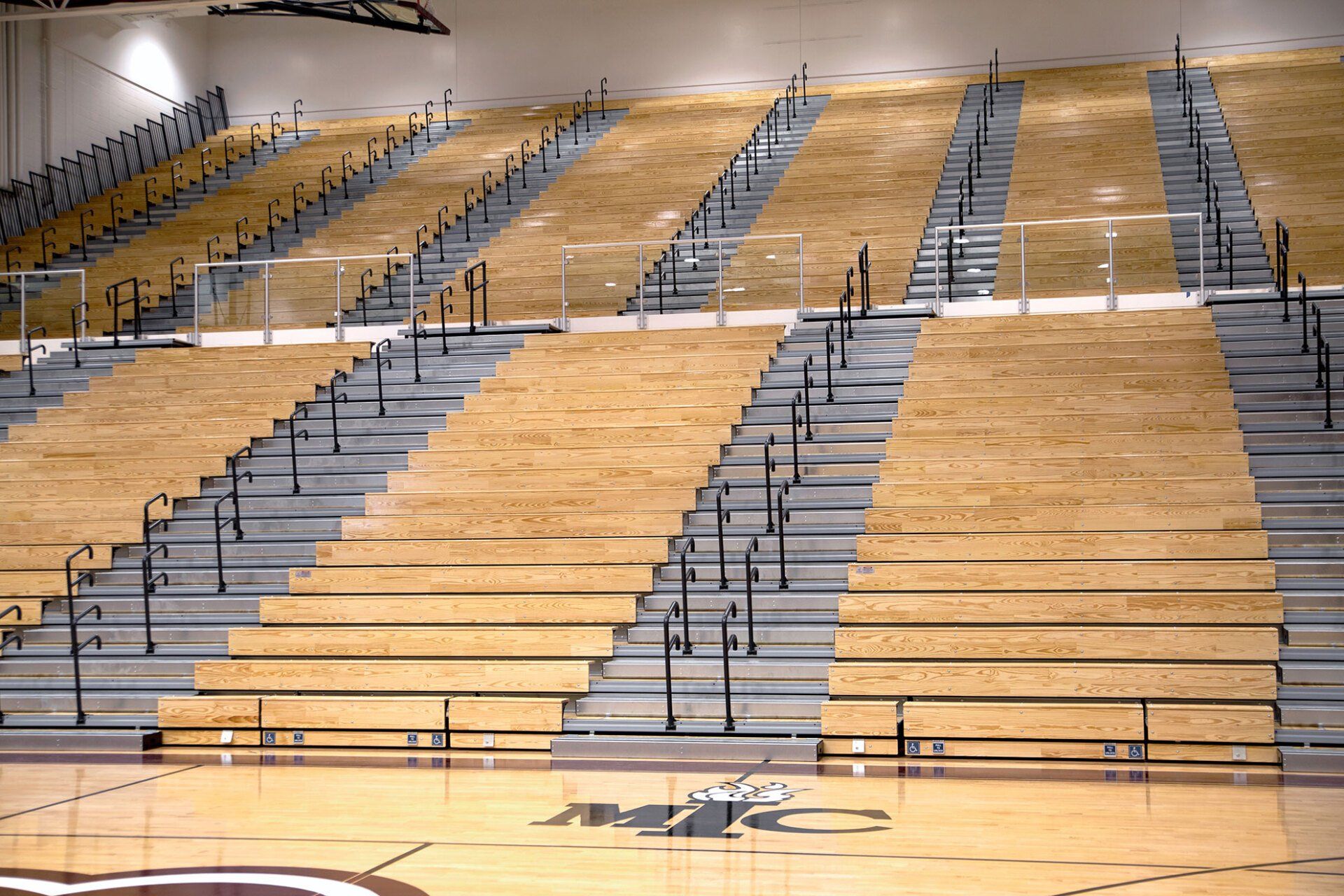 Classic Wood Bleachers with Self-Storing Aisle Rails (SSAR) in the gymnasium at Lawrence Central High School in Indiana.