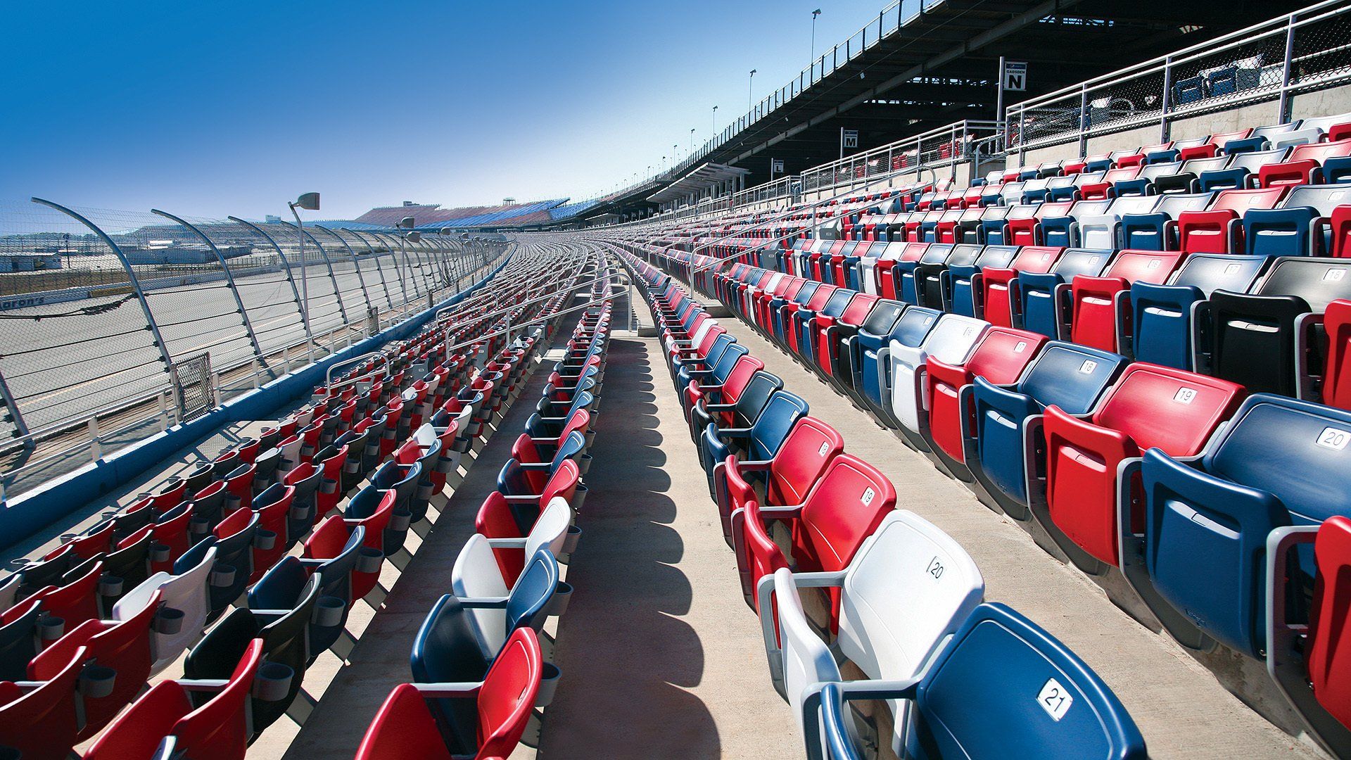 Interkal AURA Solid Stadium Chairs in red, white, blue and black at the iconic Talladega Superspeedway.