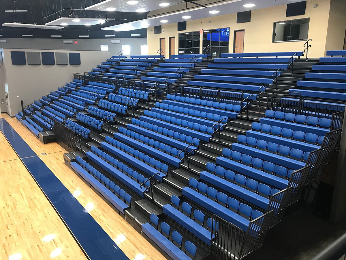 Blue Interkal EXCEL Seat Modules with ComfoBack Backrests, on a Blackout Wide Deck Premier Platform at Hennessey High School.