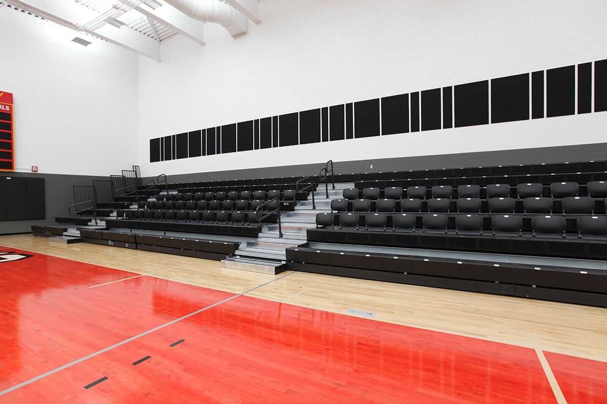 Interkal EXCEL Seat Modules with ComfoBack Backrests on a Wide Deck Premier Platform at the Ferris State University gym.