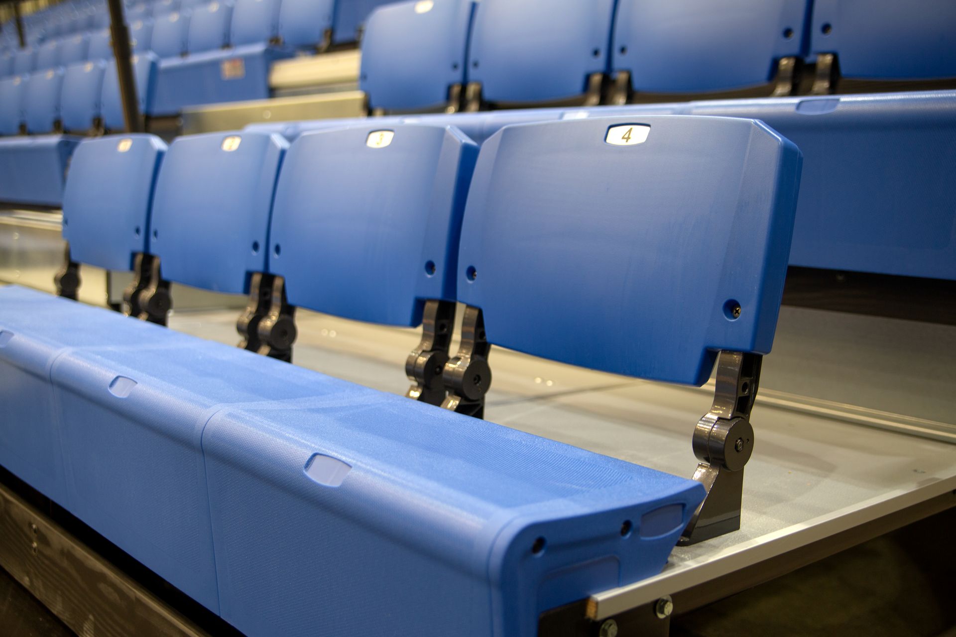 Close up of Royal Blue ESM bleachers with ComfoBack Backrest at Grand Valley State University