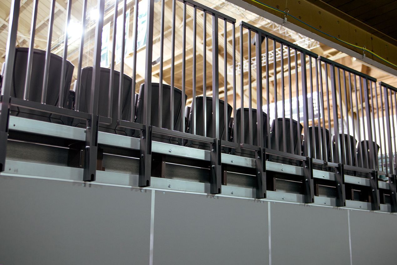 Back Panels and folding Back Rails on a wide deck premier platform telescopic system at Michigan State's Jenison Field House.
