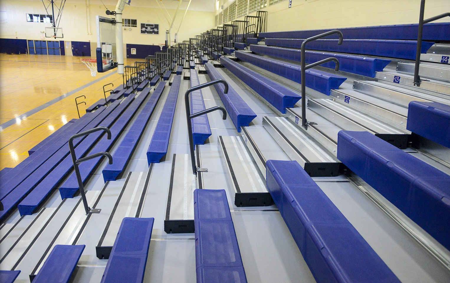 Blue Interkal EXCEL Seat Modules on a telescopic bleacher with Self-Storing Aisle Rails in Kekuhaupio, Hawaii.