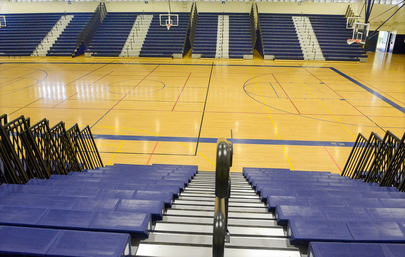 Blue Interkal EXCEL Seat Modules on a telescopic bleacher with Self-Storing Aisle Rails in Kekuhaupio, Hawaii.