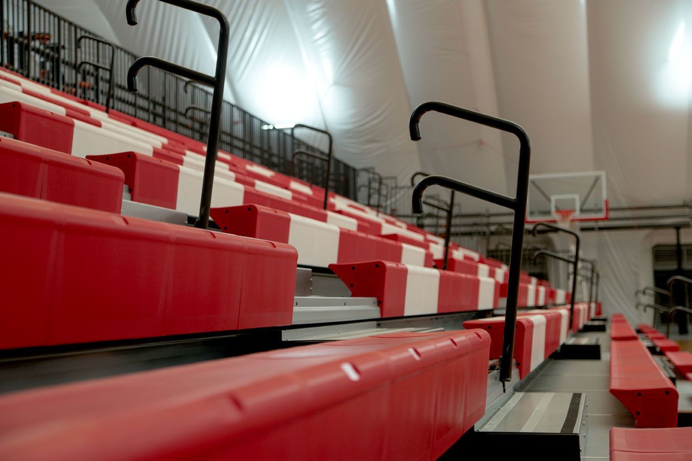 The telescopic bleacher system at the Melvindale High School dome, in Michigan, which features white school initials.