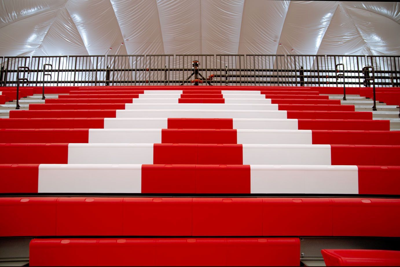 The telescopic bleacher system at the Melvindale High School dome, in Michigan, which features white school initials.