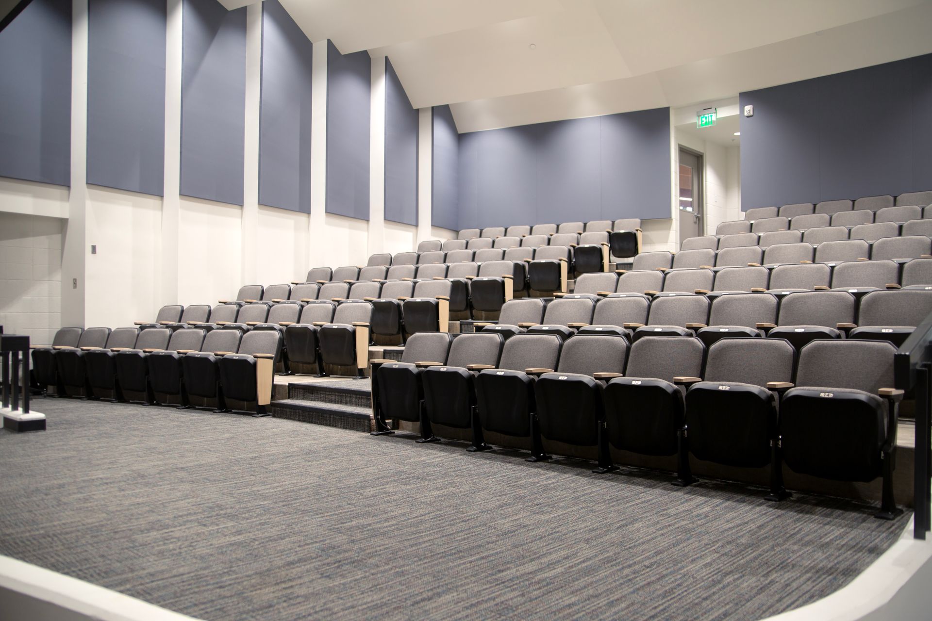 The auditorium at Montbello High School in Colorado, featuring ODYSSEY Auditorium Chairs with hardwood armrests, end panels.
