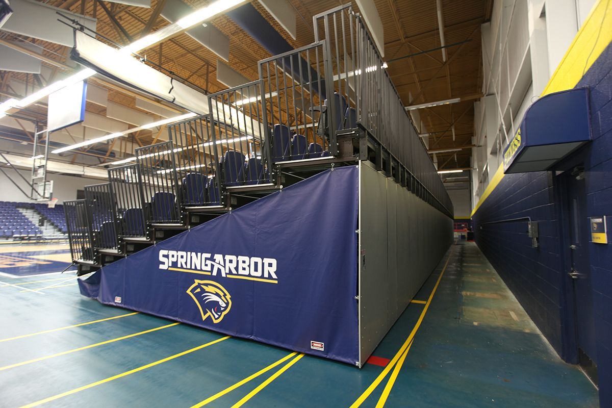 Free-standing bleachers with EXCEL Seat Modules and VISION Platform Chairs at the Spring Arbor University fieldhouse.