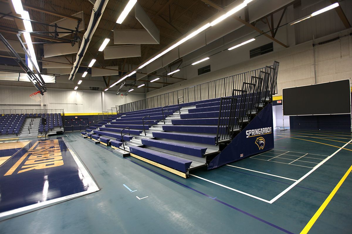 Free-standing bleachers with EXCEL Seat Modules and VISION Platform Chairs at the Spring Arbor University fieldhouse.