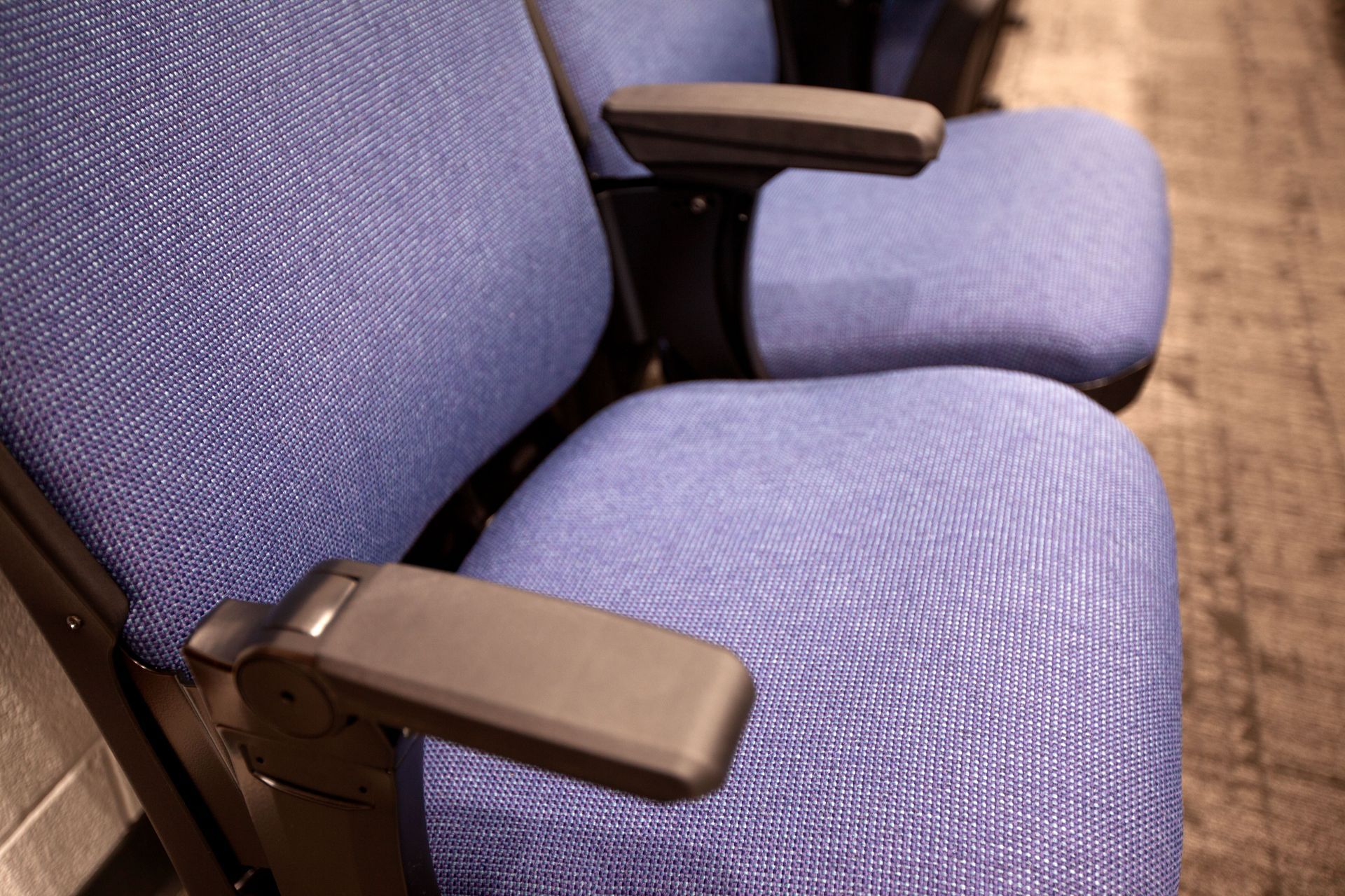 The auditorium at Sundling Junior High, with ODYSSEY Auditorium Chairs with molded armrests, blue upholstery, seat numbers. 