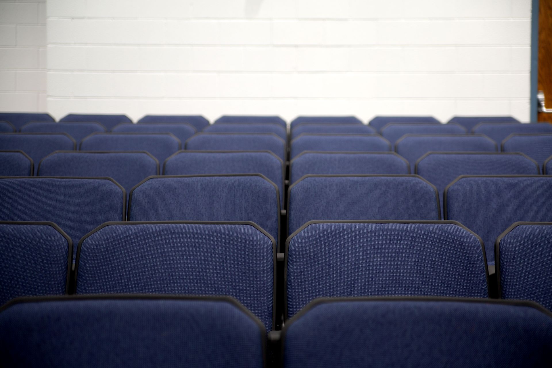 The auditorium at Sundling Junior High, with ODYSSEY Auditorium Chairs with molded armrests, blue upholstery, seat numbers. 