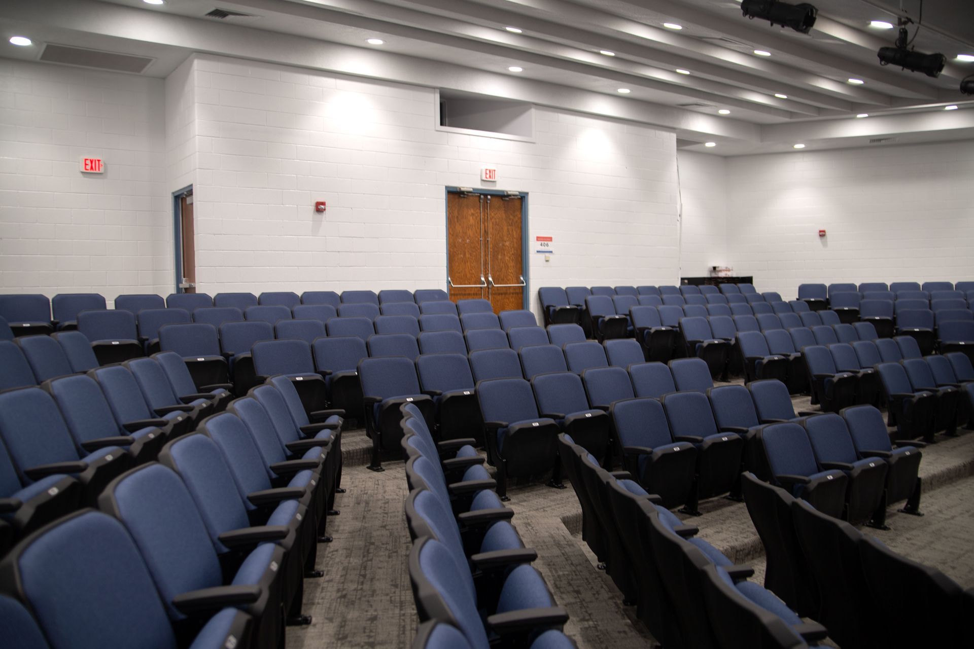 The auditorium at Sundling Junior High, with ODYSSEY Auditorium Chairs with molded armrests, blue upholstery, seat numbers. 