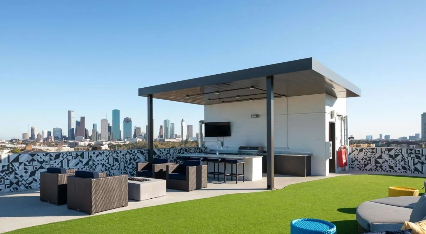 Rooftop deck with grilling area and city views