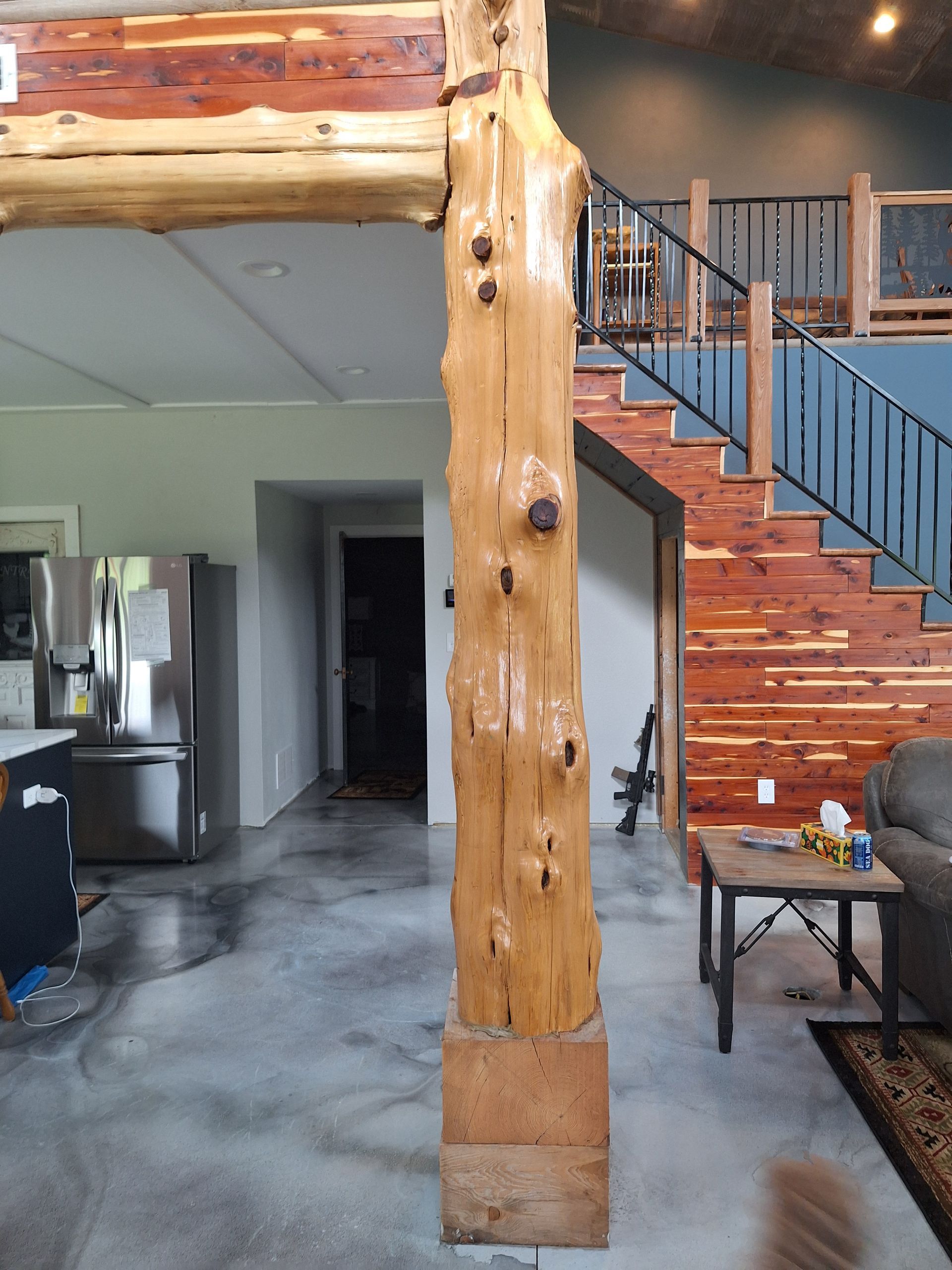 Cedar post next to cedar siding on a stairwell
