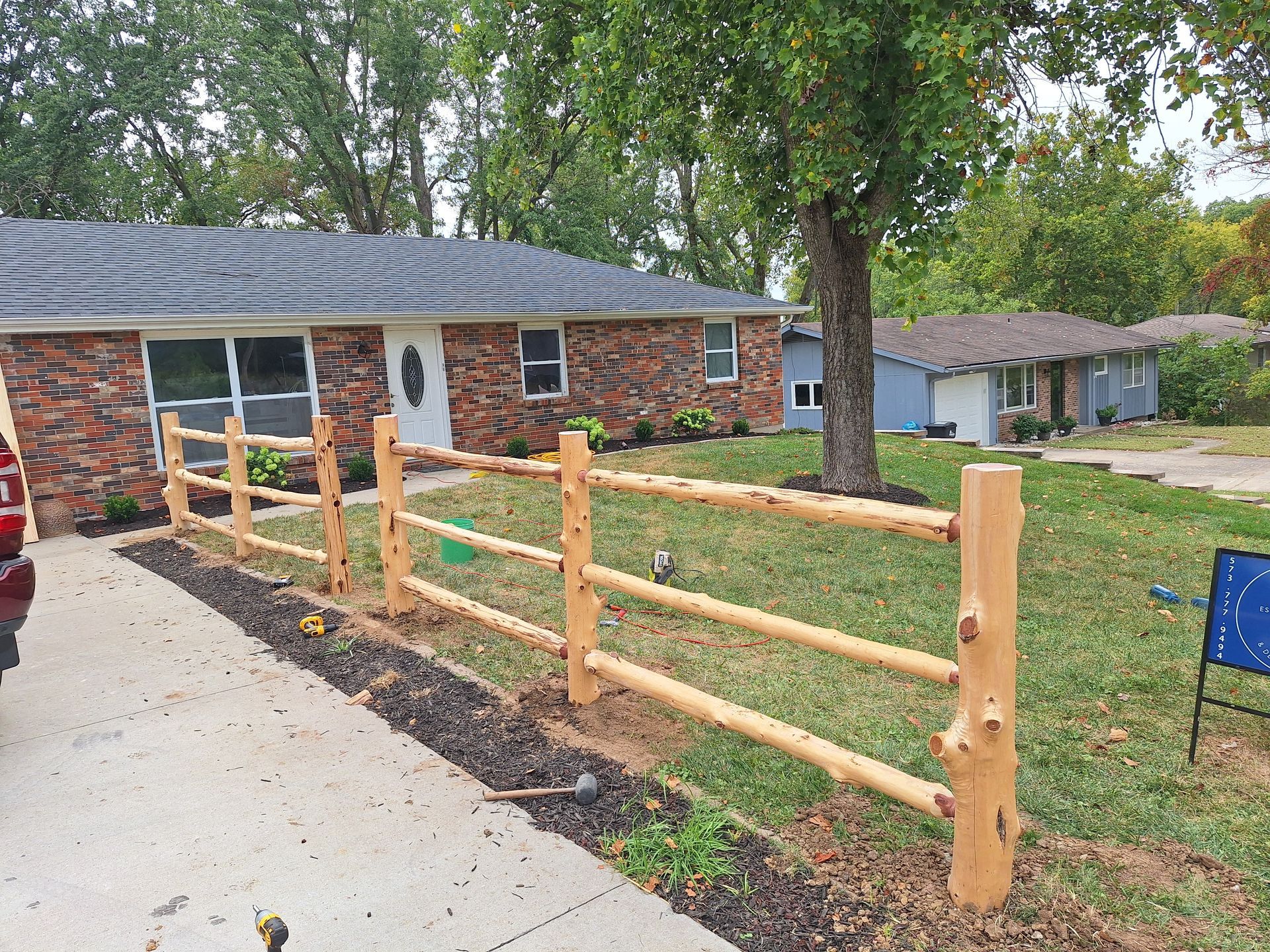 cedar fence along driveway