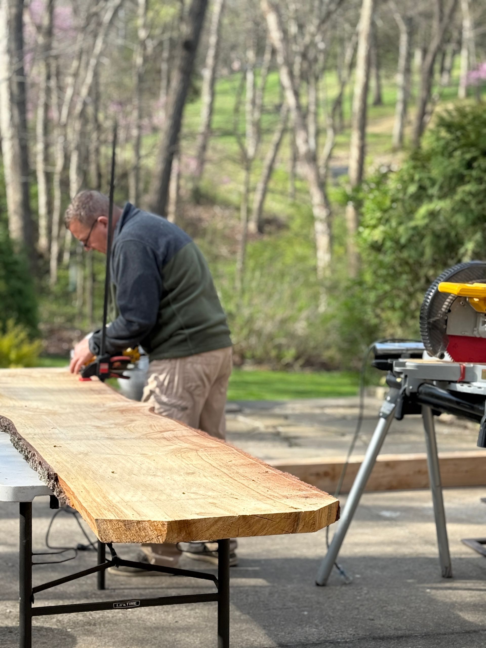 snellen wood products employee working on cedar slab